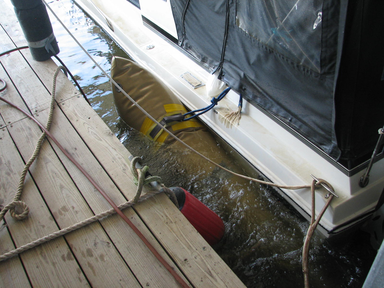 Boat approaching the surface inside the dock slip.