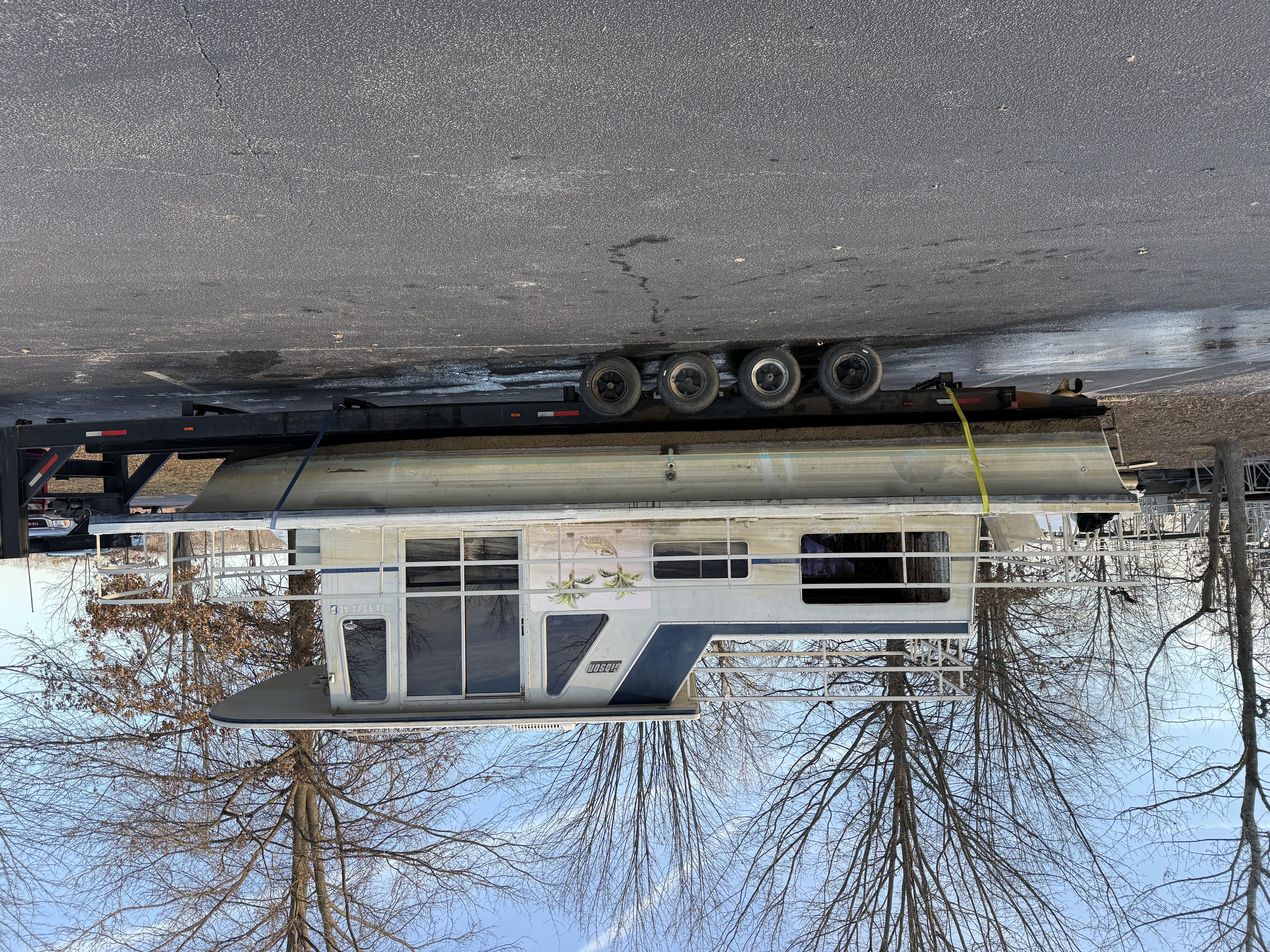 Boat sitting on trailer after being removed from water.